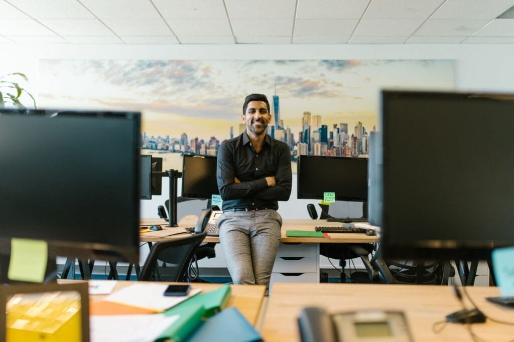 Indian entrepreneur reviewing UAE free zone company setup options in 2026 — RAKEZ, ANCFZ and IFZA compared