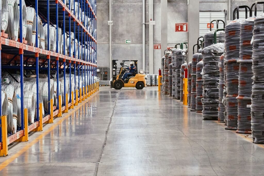 Forklift operating in an industrial warehouse — UAE free zone for industrial and logistics businesses 2026