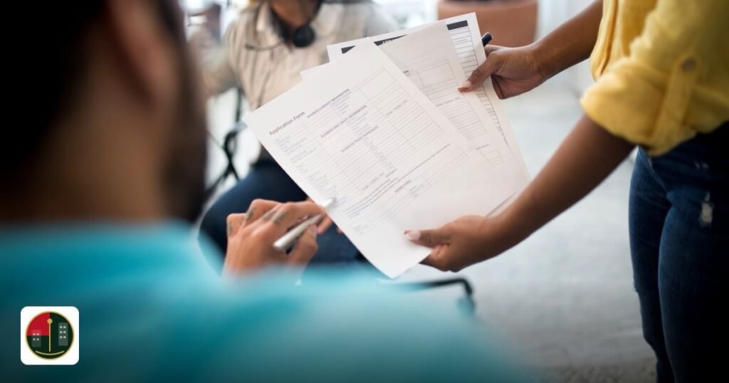 Ajman Free Zone Reviews - business professionals analyzing reports during an office meeting