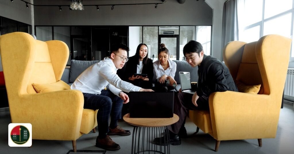 UAE Free Zone Holding Company Tax Benefits – 2026 Update - a group of colleagues engaging in a collaborative meeting
