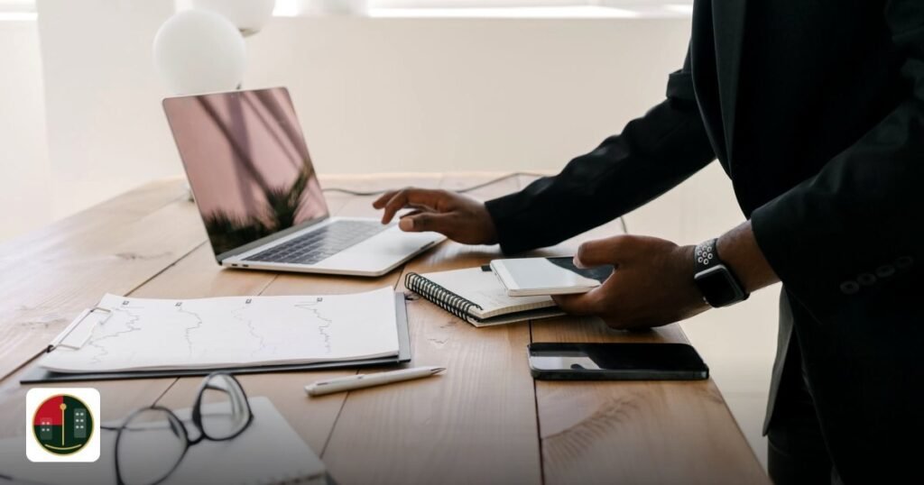 UAE Free Zone Audit Requirements: Essential Guide for Businesses - professional workspace with a laptop, documents,
